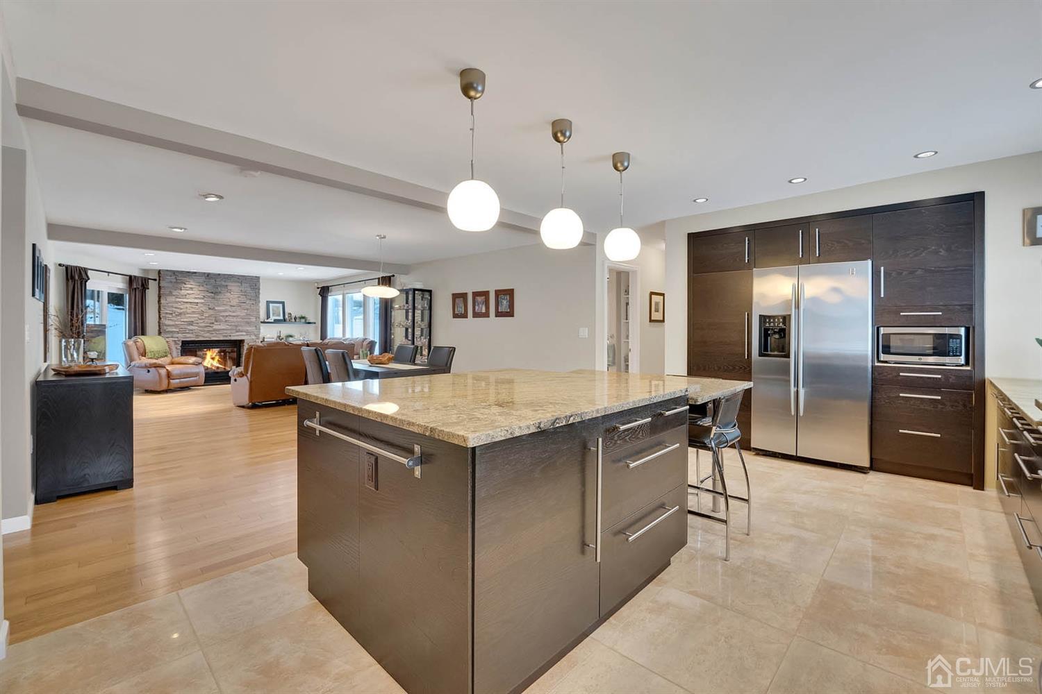 3032 Cheesequake Road Old Bridge, NJ 08859 - Photo 4 of 28 a kitchen with stainless steel appliances granite countertop a stove and a refrigerator