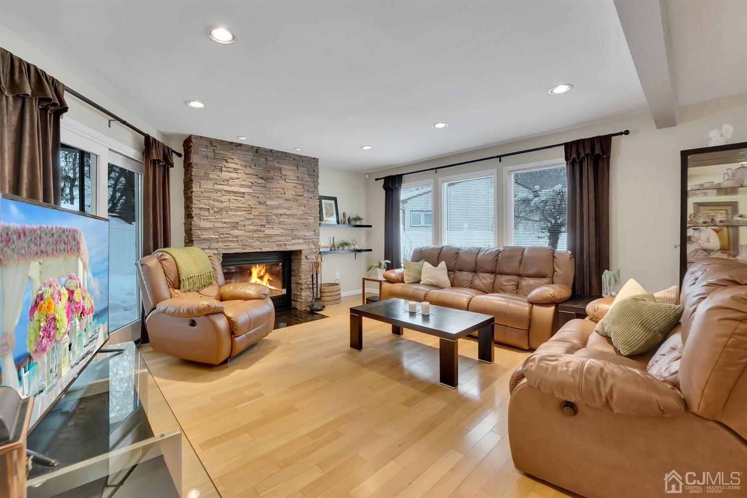 3032 Cheesequake Road Old Bridge, NJ 08859 - Photo 7 of 28 a living room with furniture and a fireplace