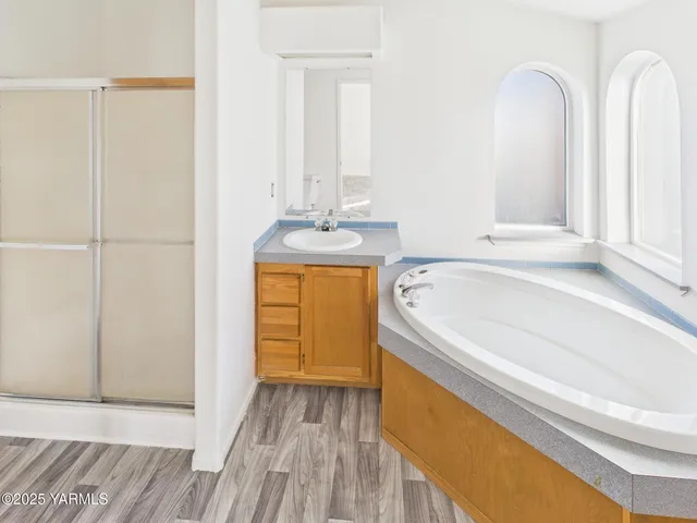 a bathroom with a bathtub and a sink