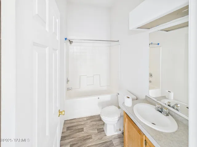 a bathroom with a sink toilet a shower and a mirror