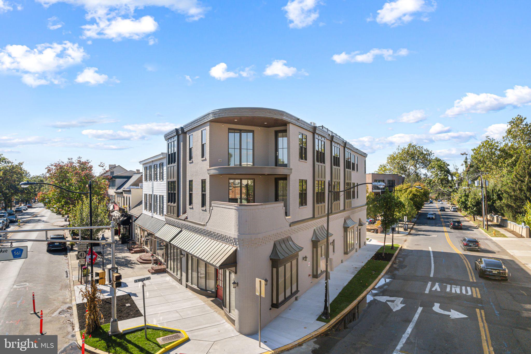 151 Kings Highway East, Unit A Haddonfield, NJ 08033 - Photo 1 of 24 a front view of a house with a yard