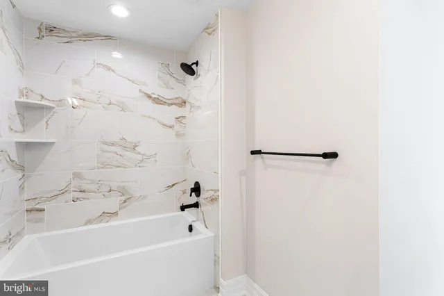 a view of bathroom with a toilet and a shower