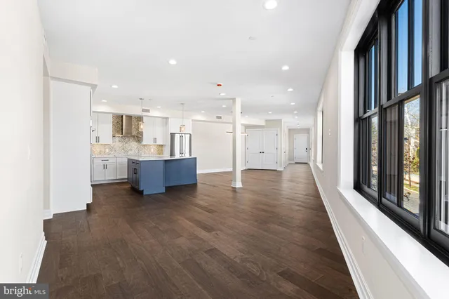 a view of a kitchen with a sink and cabinets