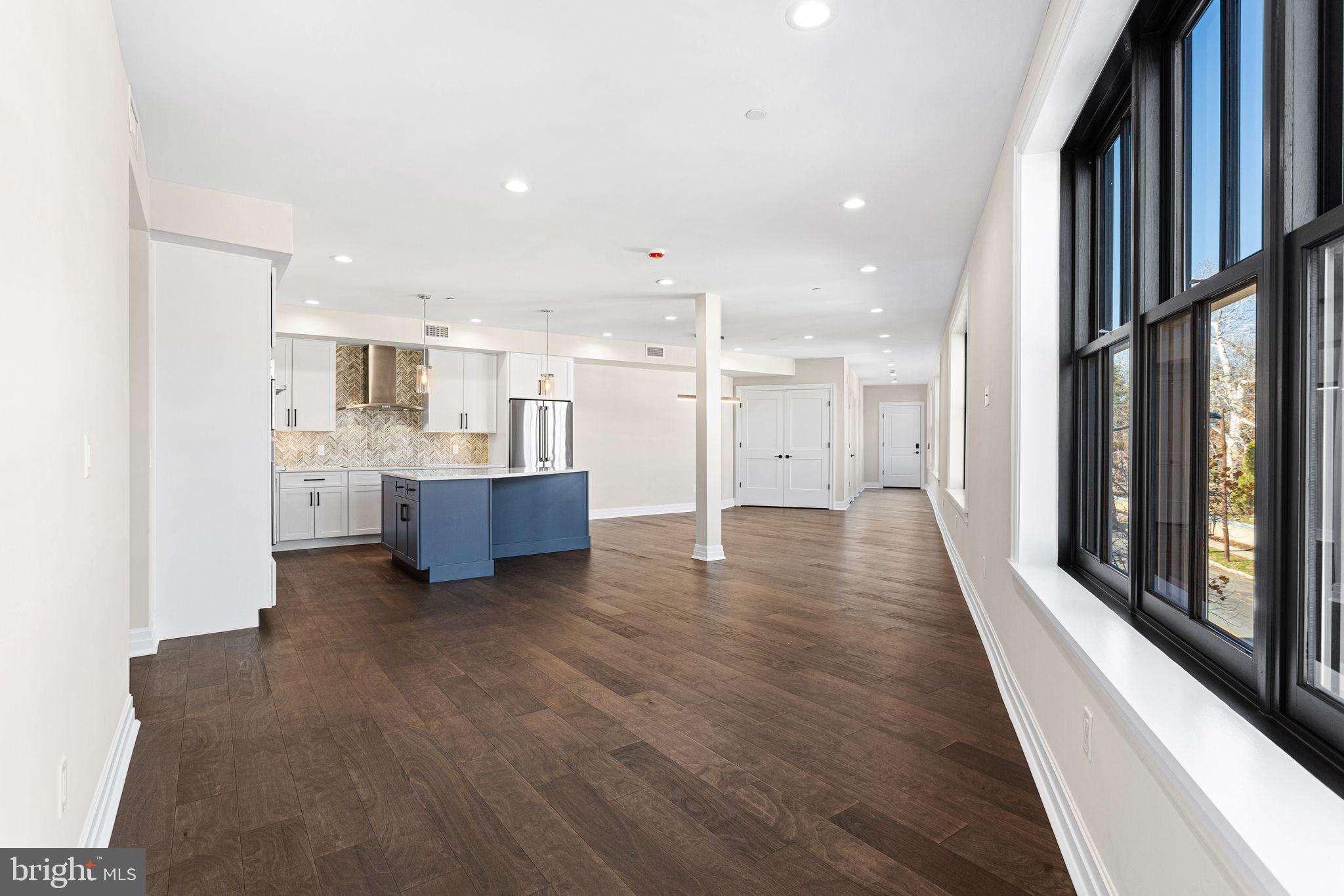 151 Kings Highway East, Unit A Haddonfield, NJ 08033 - Photo 2 of 24 a view of a kitchen with a sink and cabinets