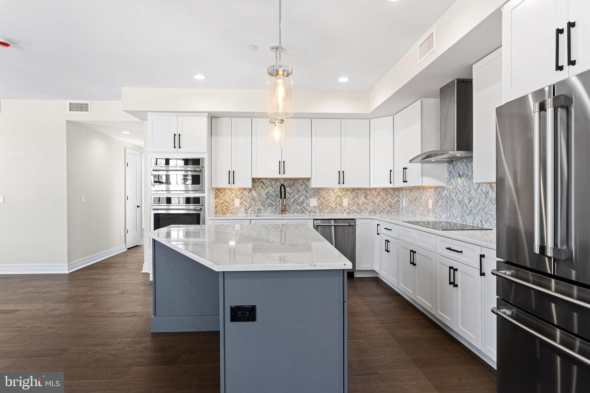151 Kings Highway East, Unit A Haddonfield, NJ 08033 - Photo 3 of 24 a kitchen with stainless steel appliances granite countertop a sink stove and refrigerator