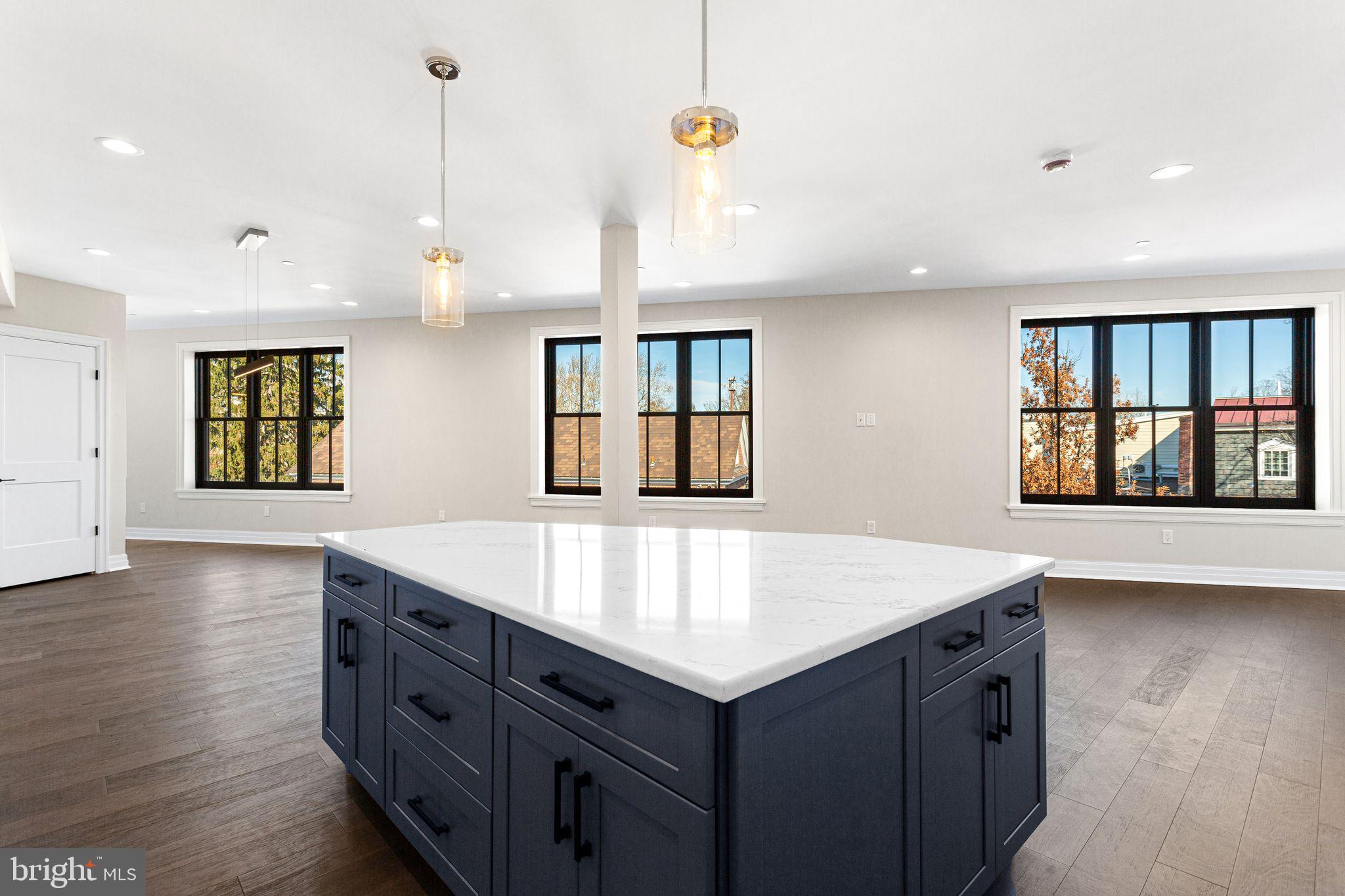 151 Kings Highway East, Unit A Haddonfield, NJ 08033 - Photo 5 of 24 a kitchen with a wooden floor and window