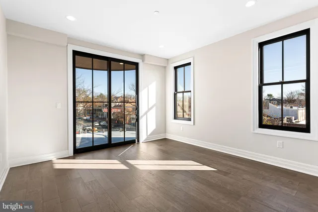 a bathroom with a double vanity sink mirror and shower