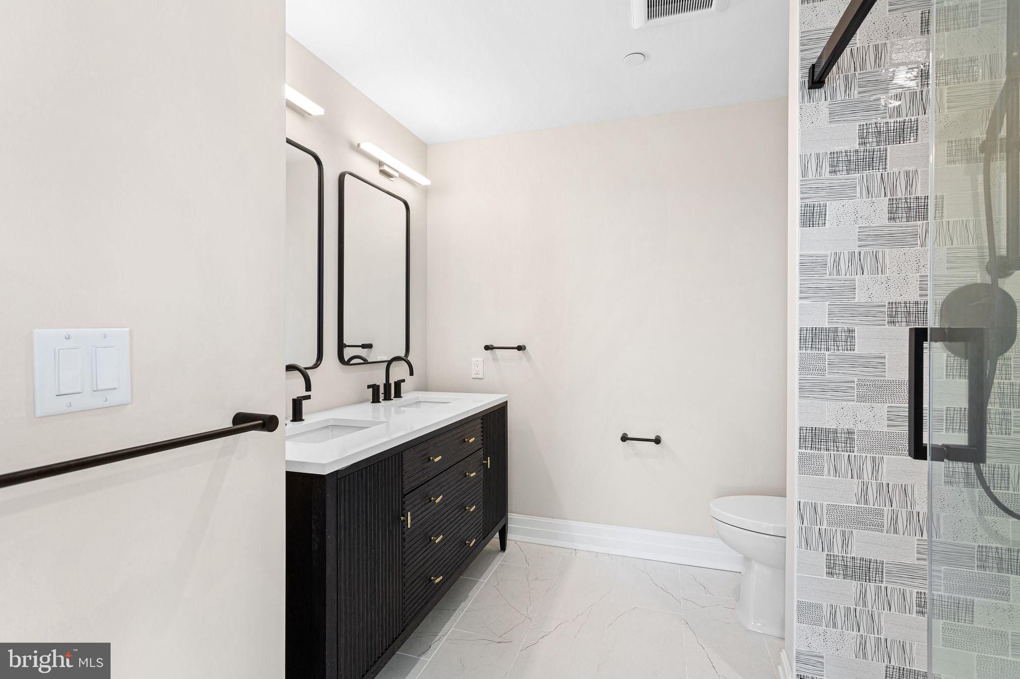 151 Kings Highway East, Unit A Haddonfield, NJ 08033 - Photo 10 of 24 a bathroom with a double vanity sink mirror and shower