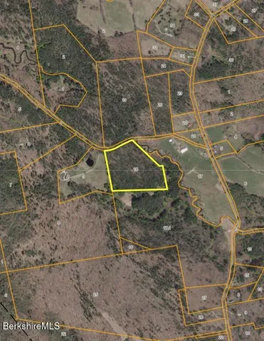 a bathroom with a sink shower and a mirror