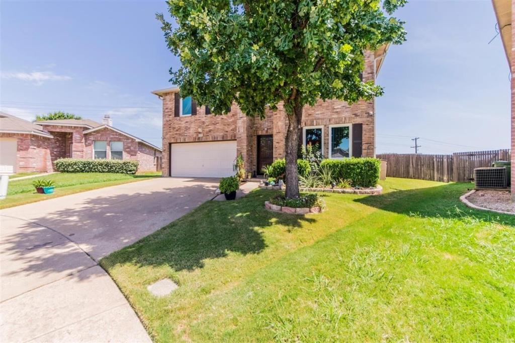 8301 Redheart Street Arlington, TX 76002 - Photo 1 of 1 a front view of house with yard and green space