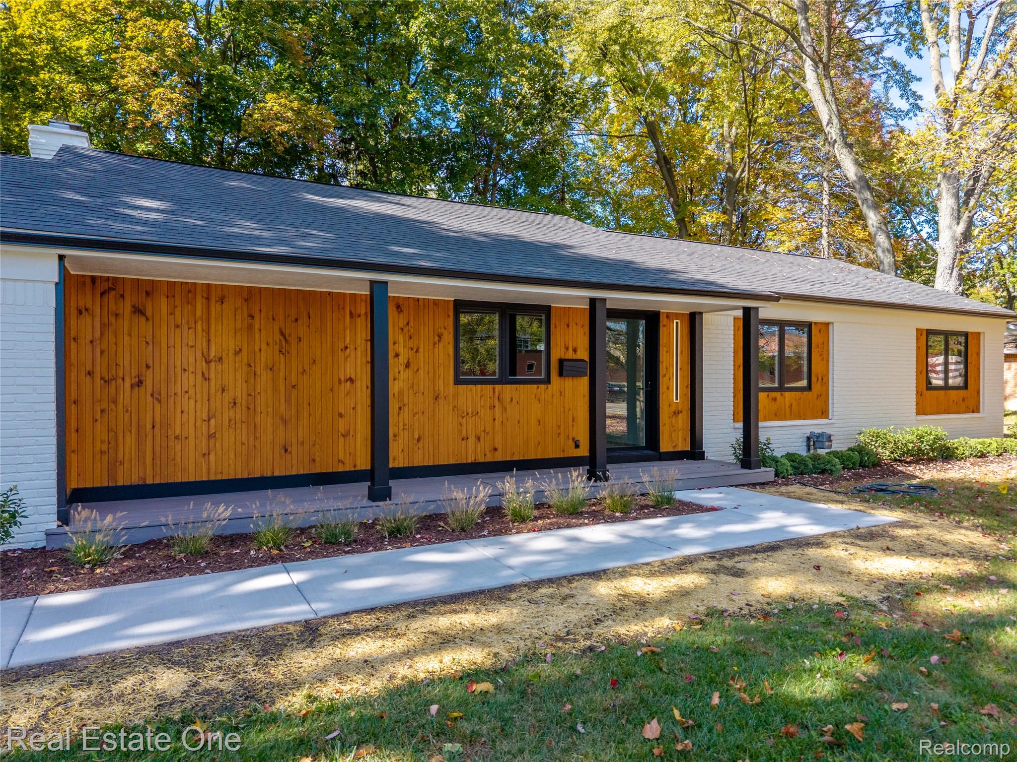 786 South Cranbrook Road Bloomfield Hills, MI 48301 - Photo 2 of 38 View of front facade featuring brick siding, a porch, a chimney, and roof with shingles