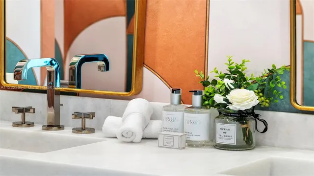 a bathroom with a sink mirror and vanity