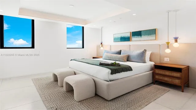 a bedroom with a bed and a couch