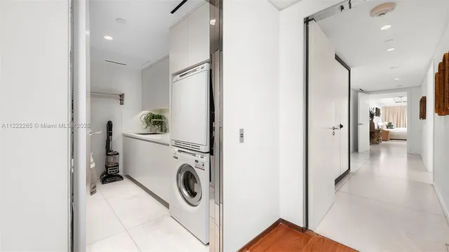 a view of a hallway with washer and dryer