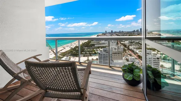 a view of a balcony with an ocean view