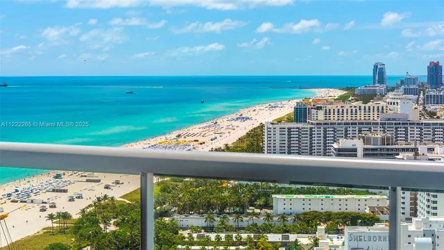 a patio with wooden floor and outdoor seating