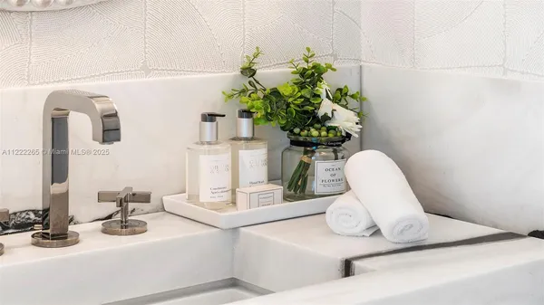 a bathroom with a sink and mirror