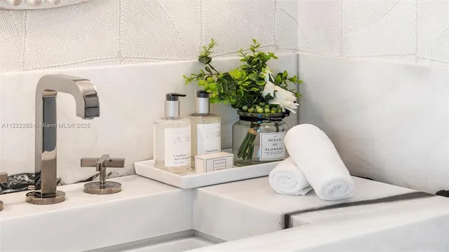 a bathroom with a sink and mirror