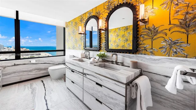 a bathroom with a tub and a large window