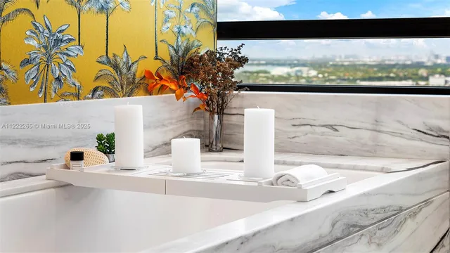 a bedroom with a bed and a wall painting