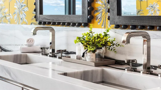 a living room with furniture a rug and a wall painting