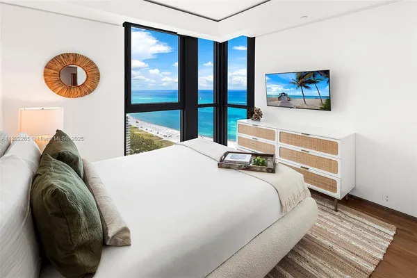 a living room with couch and a flat screen tv