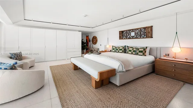 a bedroom with a bed and a couch