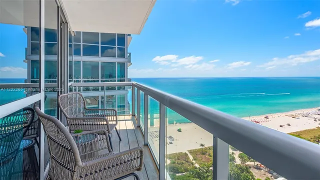 a view of a balcony with an ocean view