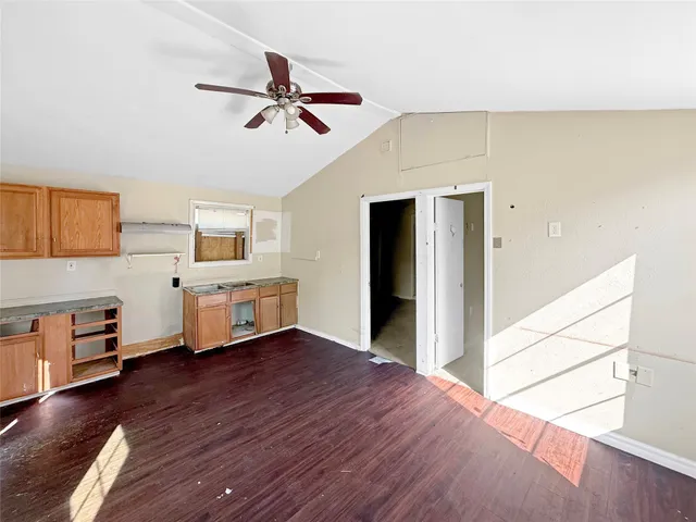 a view of a livingroom with furniture and wooden floor