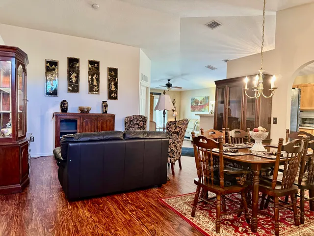 a bedroom with furniture and a chandelier