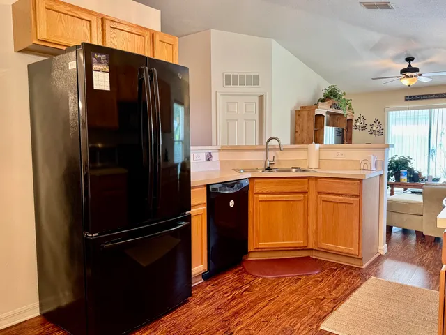 a kitchen with a sink cabinets and appliances