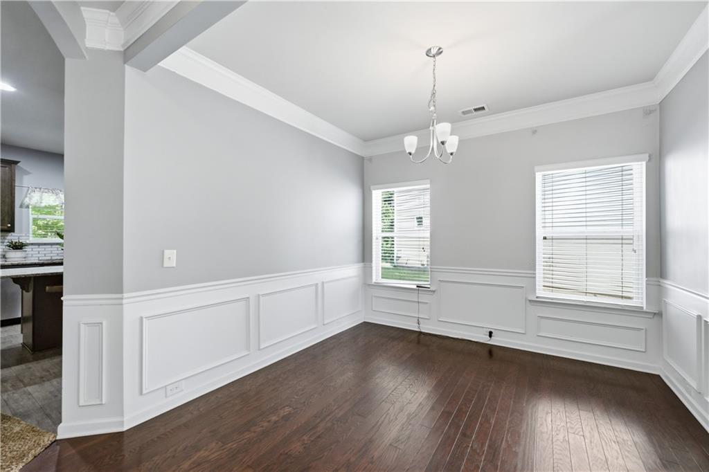 291 Boulder Run Hiram, GA 30141 - Photo 5 of 46 an empty room with wooden floor and windows