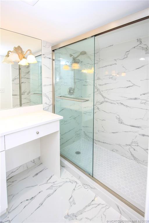 8750 South Ocean Drive, Unit 1635 Jensen Beach, FL 34957 - Photo 18 of 36 a bathroom with a shower and a sink