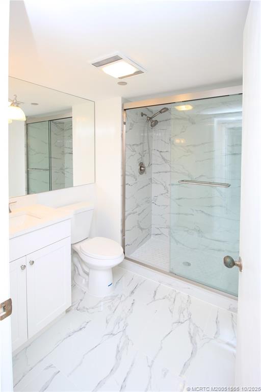 8750 South Ocean Drive, Unit 1635 Jensen Beach, FL 34957 - Photo 22 of 36 a bathroom with a shower and a toilet