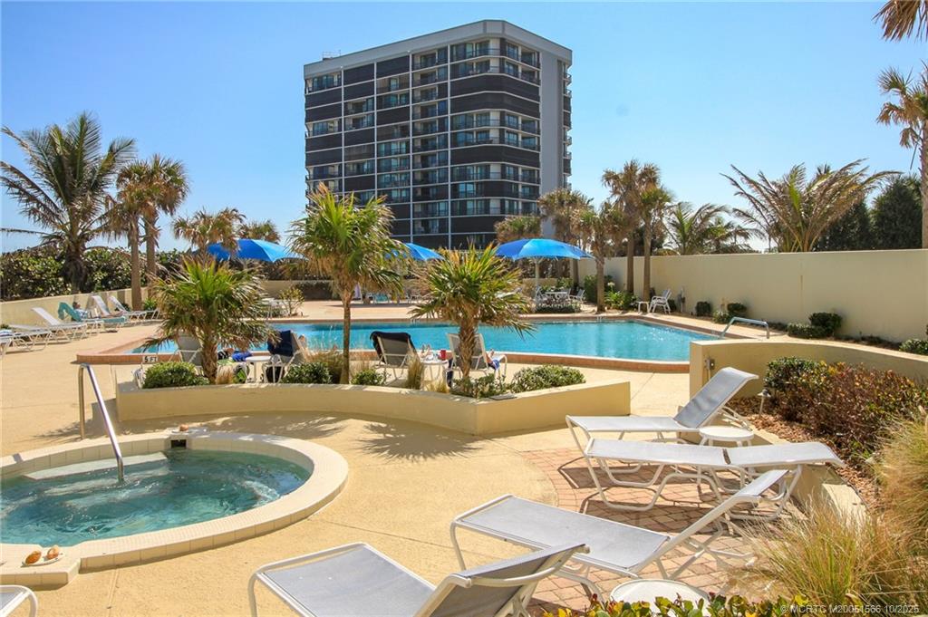 8750 South Ocean Drive, Unit 1635 Jensen Beach, FL 34957 - Photo 23 of 36 a view of a swimming pool with a patio