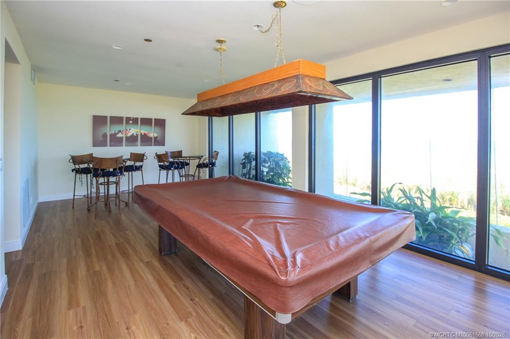 8750 South Ocean Drive, Unit 1635 Jensen Beach, FL 34957 - Photo 35 of 36 a bed sitting in a room next to a window