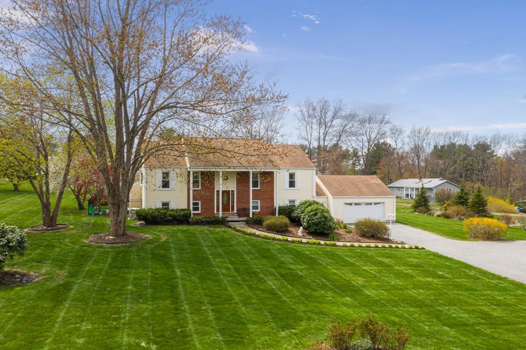 13 Uptack Road Groveland, MA 01834 - Photo 1 of 42 a front view of a house with a yard and trees