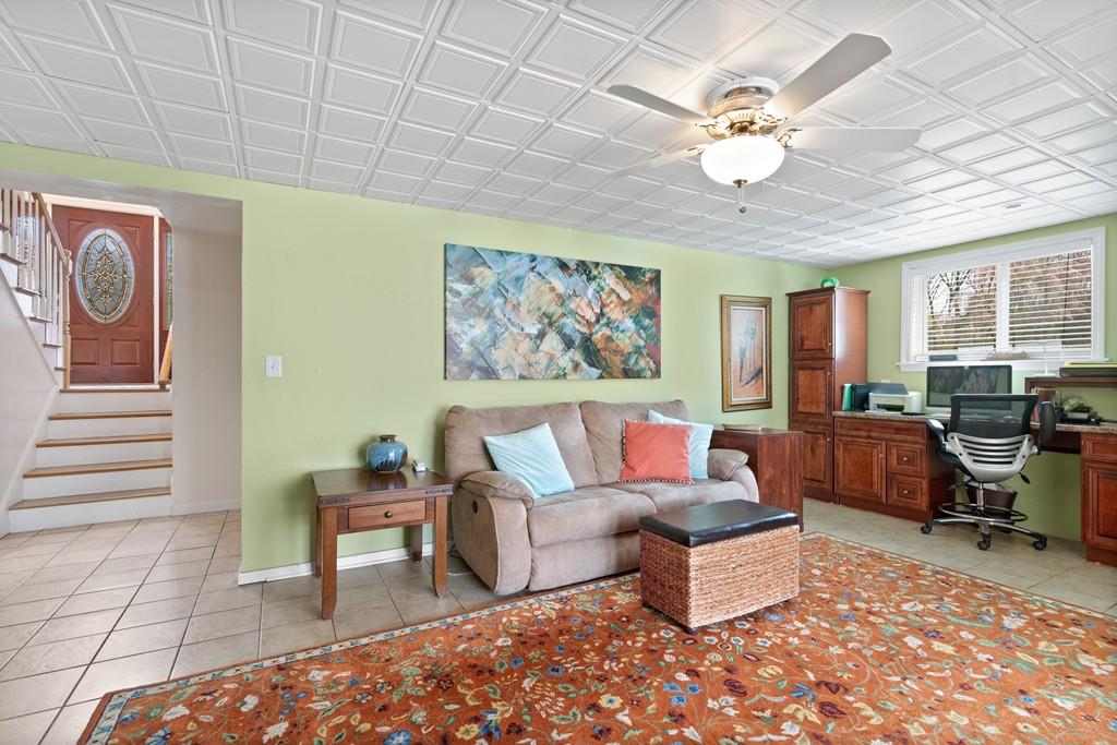 13 Uptack Road Groveland, MA 01834 - Photo 25 of 42 a living room with furniture and a chandelier