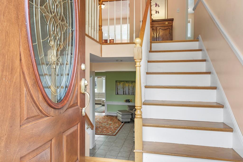 13 Uptack Road Groveland, MA 01834 - Photo 3 of 42 a view of entryway with wooden floor and a rug
