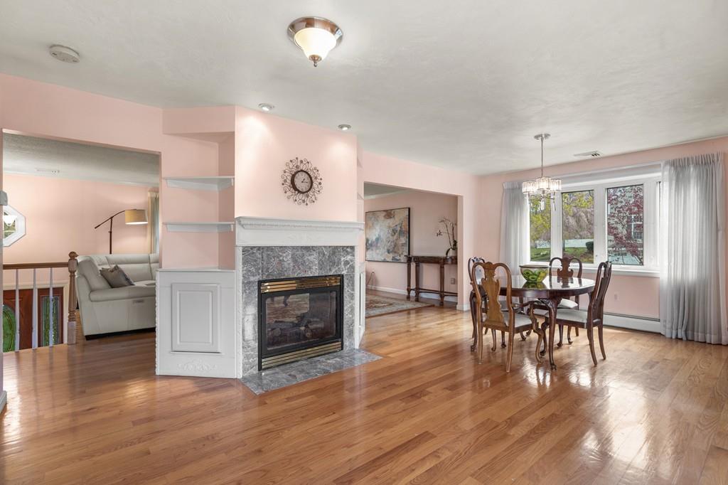 13 Uptack Road Groveland, MA 01834 - Photo 9 of 42 a view of a livingroom with furniture and a fireplace