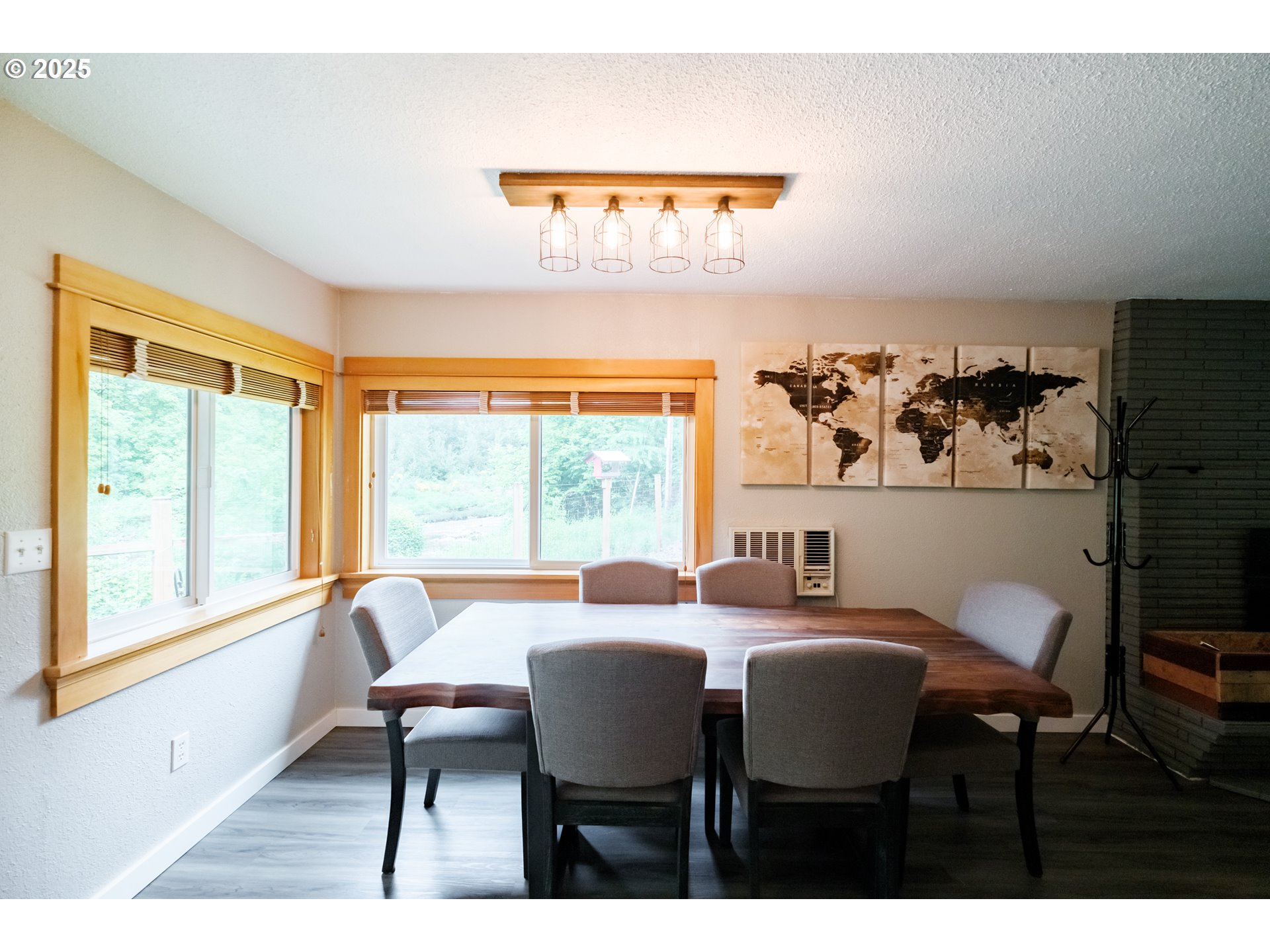 40325 Upper Calapooia Drive Sweet Home, OR 97386 - Photo 11 of 42 a dining room with furniture a rug and a large window
