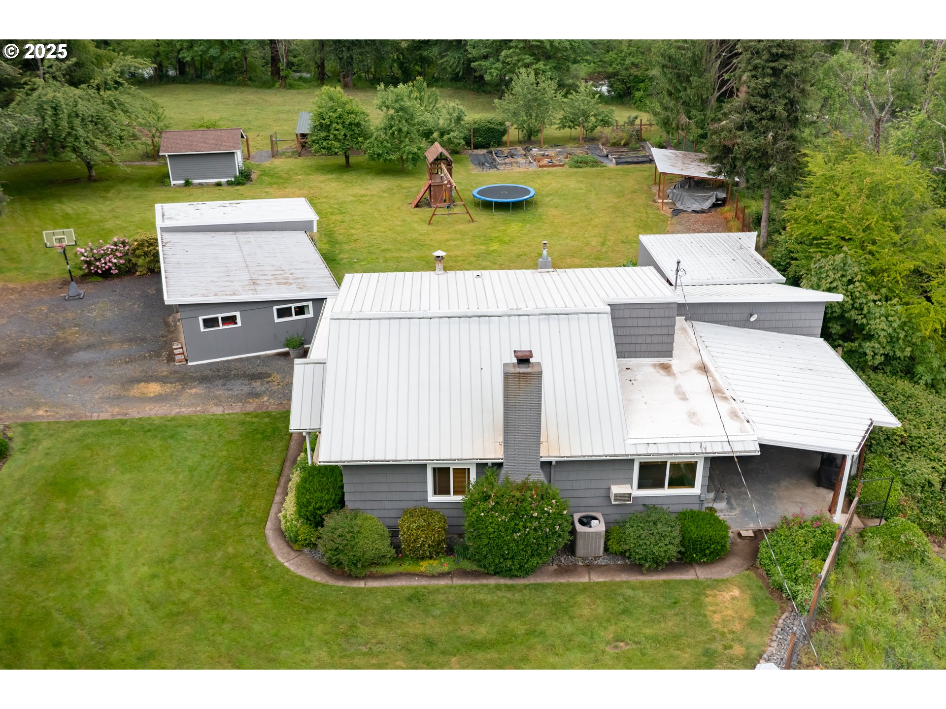 40325 Upper Calapooia Drive Sweet Home, OR 97386 - Photo 26 of 42 a view of a house with pool and a chairs