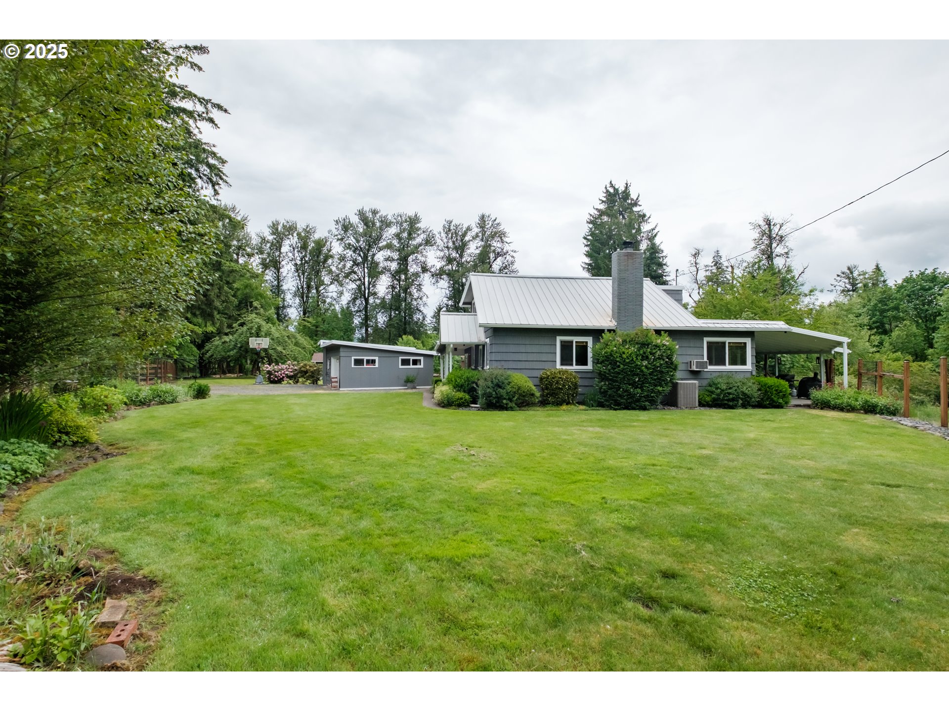 40325 Upper Calapooia Drive Sweet Home, OR 97386 - Photo 30 of 42 a front view of a house with a garden