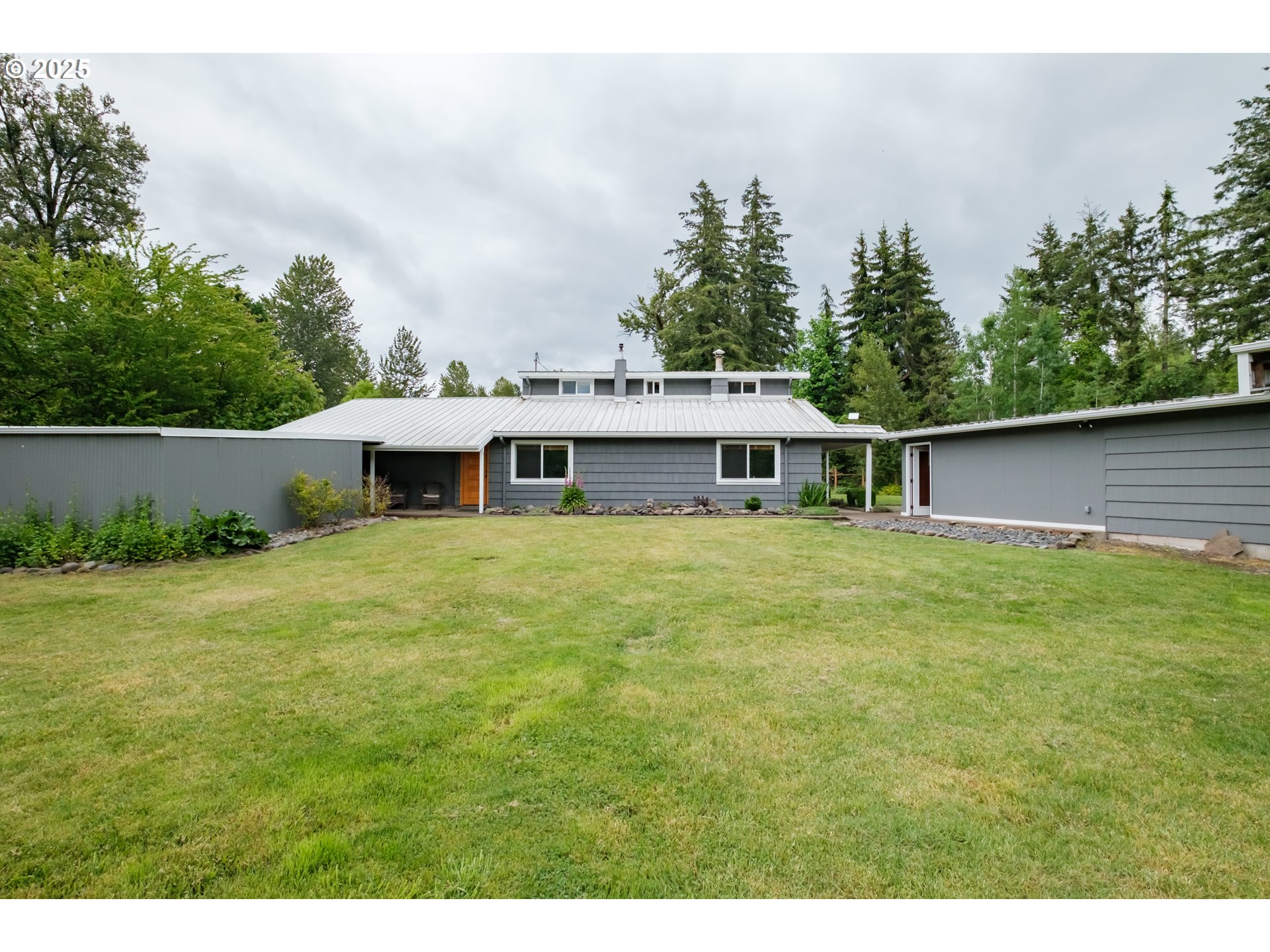40325 Upper Calapooia Drive Sweet Home, OR 97386 - Photo 31 of 42 a front view of house with yard and trees in the background