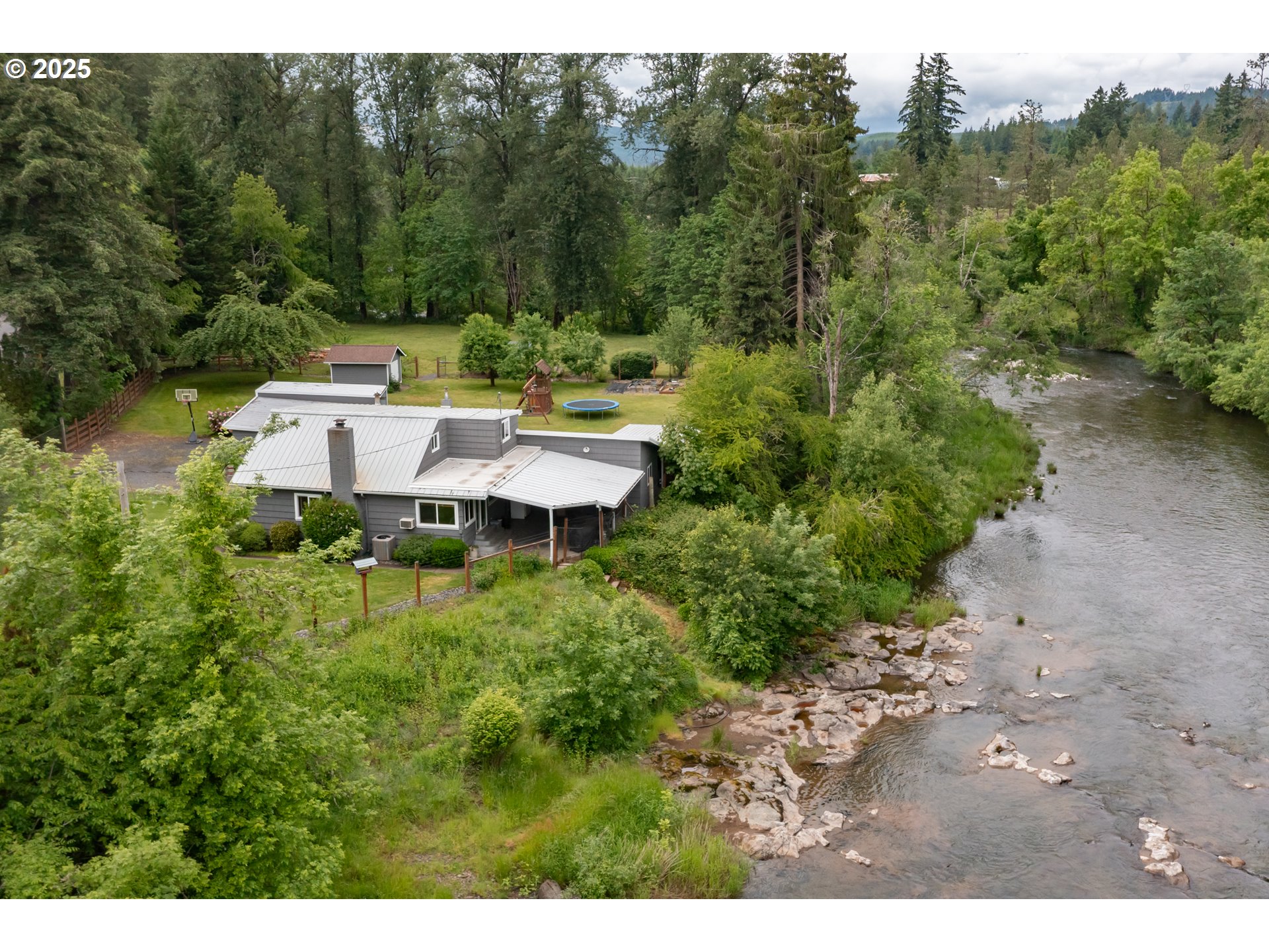 40325 Upper Calapooia Drive Sweet Home, OR 97386 - Photo 41 of 42 a view of a chairs and table in the backyard