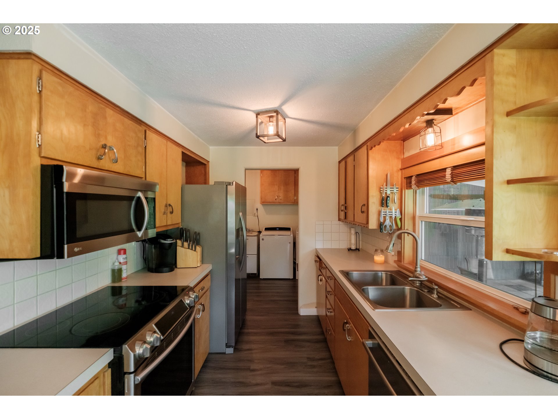 40325 Upper Calapooia Drive Sweet Home, OR 97386 - Photo 10 of 42 a kitchen with stainless steel appliances a sink stove and refrigerator