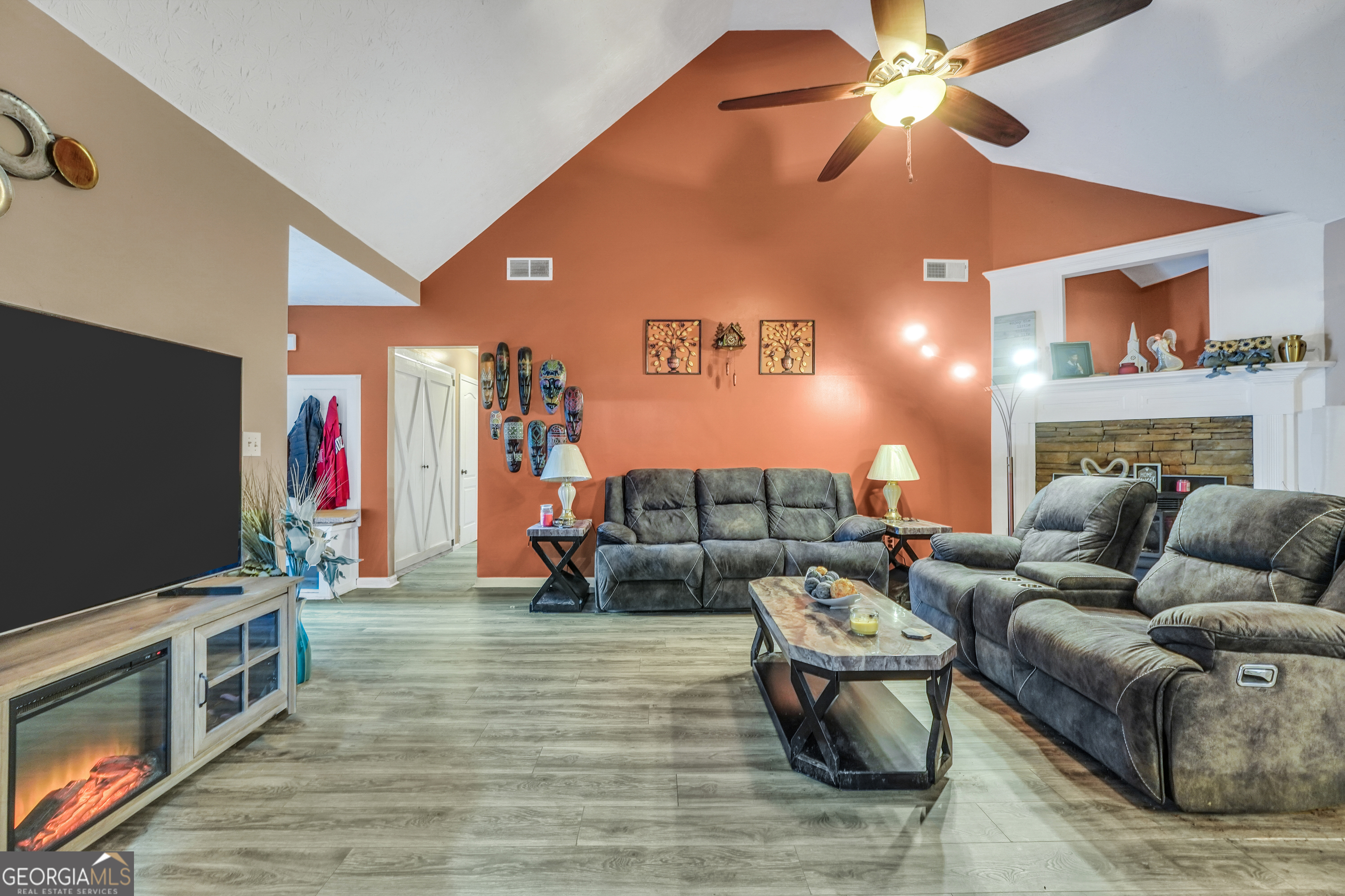 610 Kyle Court Locust Grove, GA 30248 - Photo 11 of 35 a living room with furniture and a flat screen tv