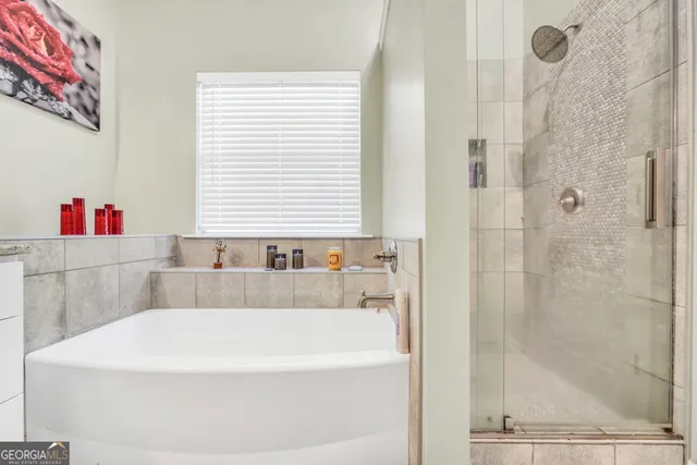a white bath tub sitting next to a window