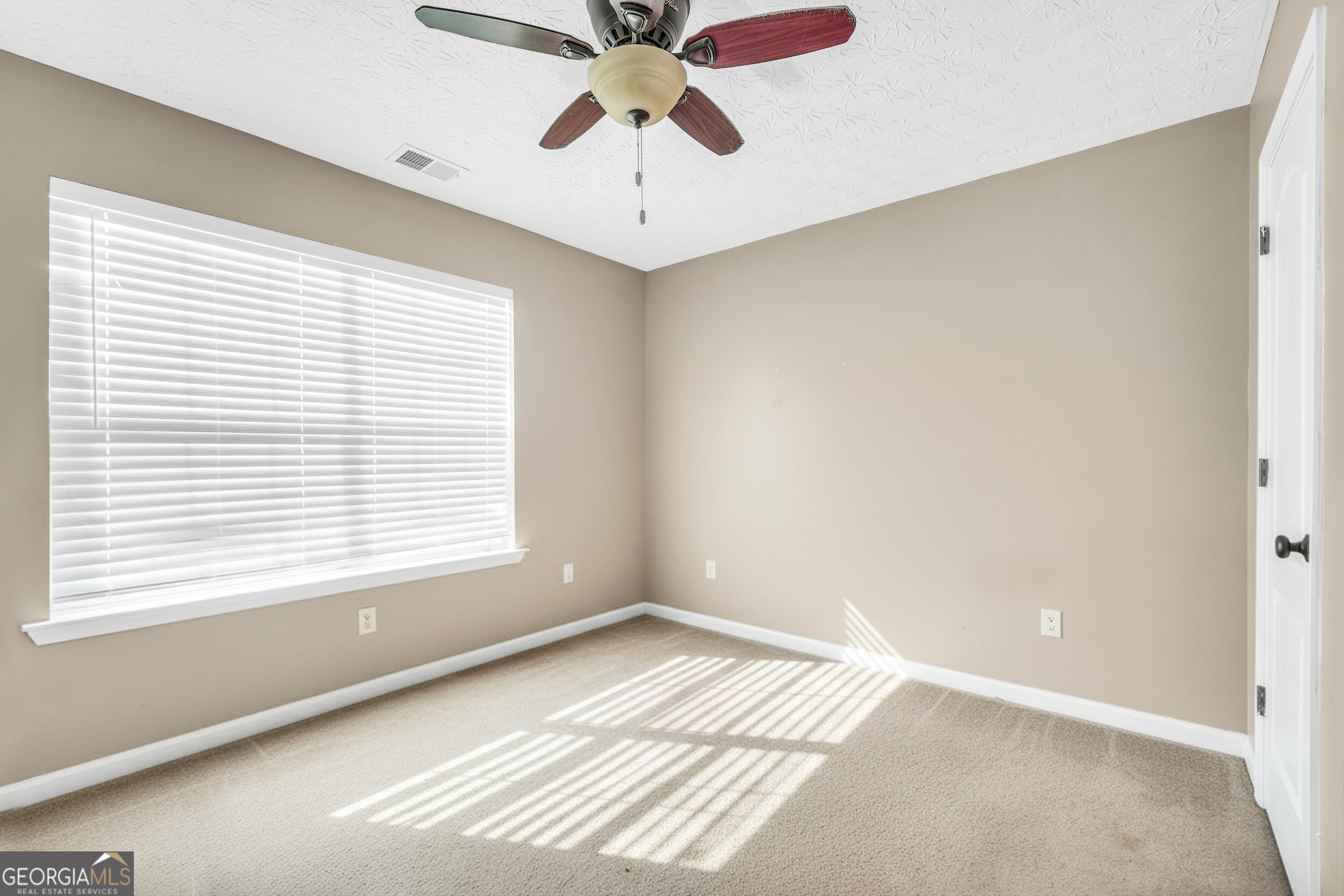 610 Kyle Court Locust Grove, GA 30248 - Photo 22 of 35 a view of a room with a window
