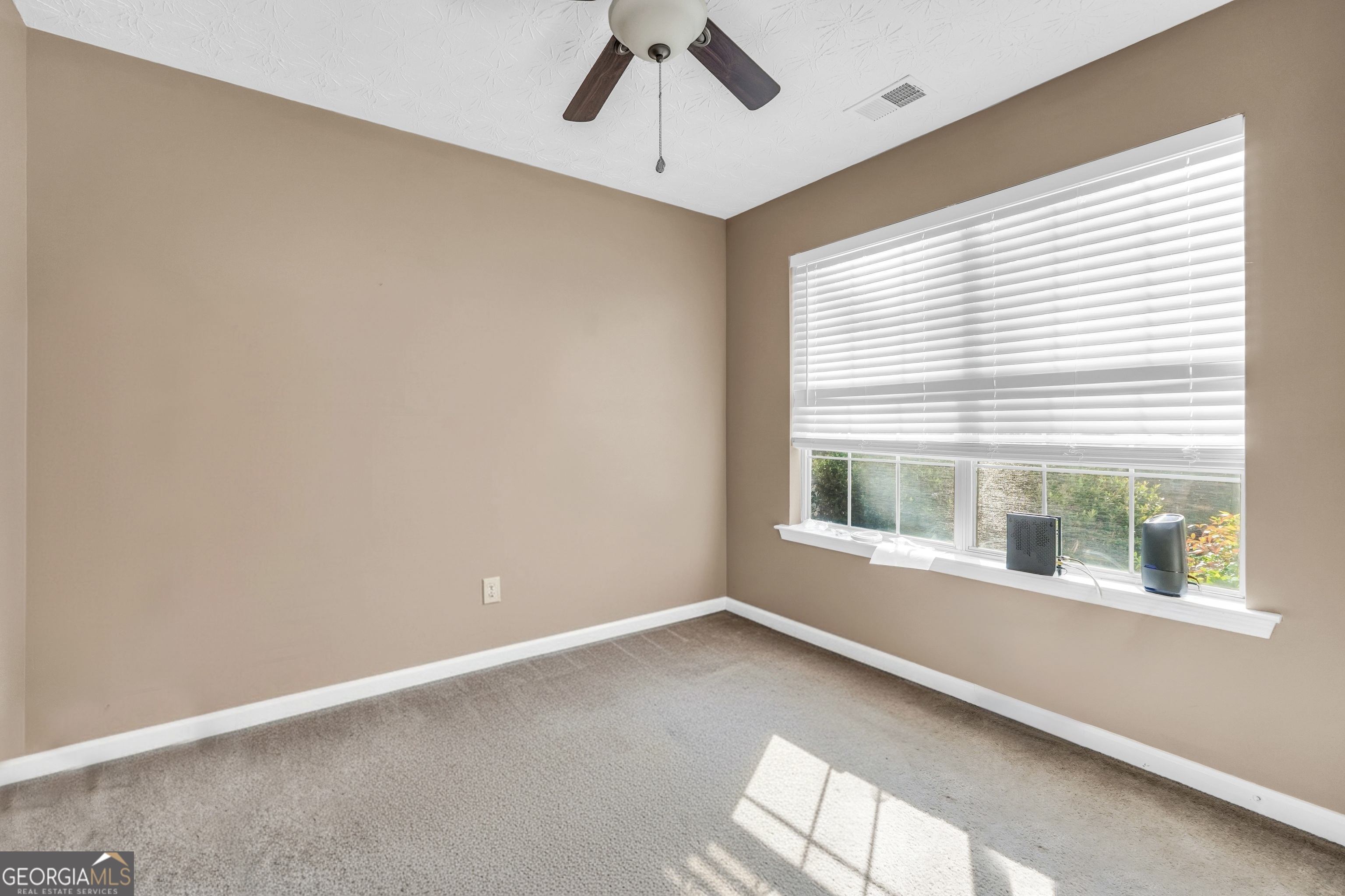 610 Kyle Court Locust Grove, GA 30248 - Photo 24 of 35 an empty room with a window